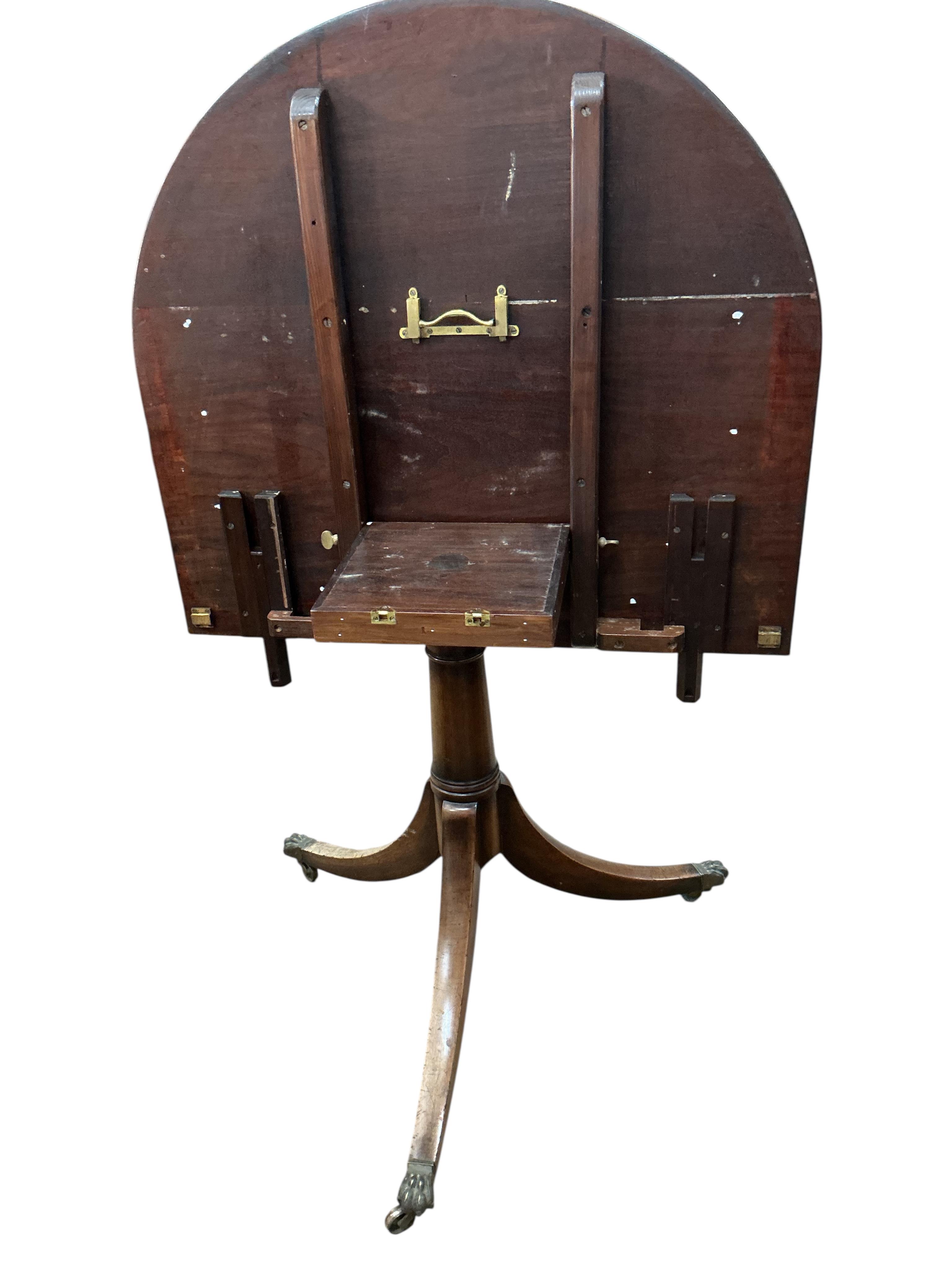 A George III style mahogany twin pillar 'D' end extending dining table, width 260cm extended, two spare leaves, depth 91cm, height 72cm